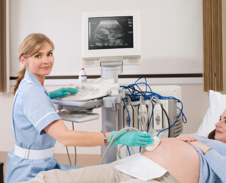 nurse-giving-ultrasound-scan-to-pregnant-woman-in-2025-10-14-05-13-16-utc